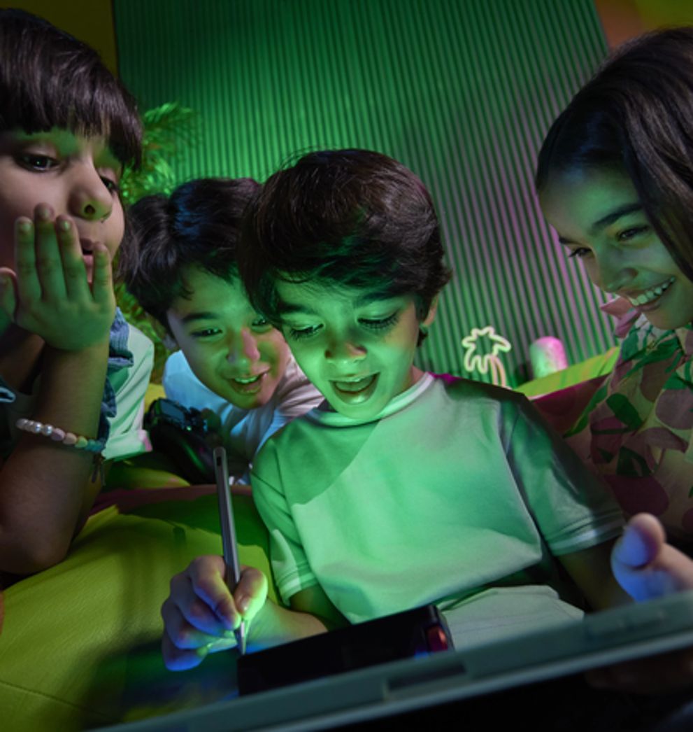 Children drawing on tablets at home connected to Salam fibre high-speed home internet in Saudi Arabia